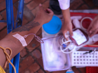 A Nepali blood donor donates blood in a blood donation campaign organized at Patan Durbar Square, a UNESCO World Heritage Site on the occasi...