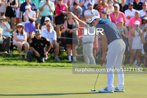 Viktor Hovland of Oslo, Norway putts on the 18th green during a playoff against Denny McCarthy of Jupiter, Florida during the final round of...