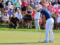 Viktor Hovland of Oslo, Norway putts on the 18th green during a playoff against Denny McCarthy of Jupiter, Florida during the final round of...