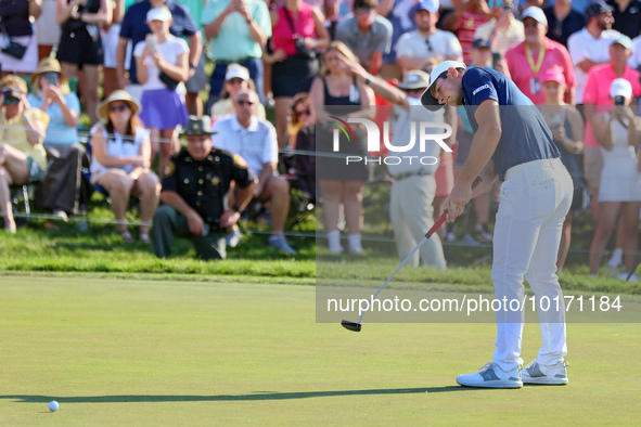 Viktor Hovland of Oslo, Norway putts on the 18th green during a playoff against Denny McCarthy of Jupiter, Florida during the final round of...