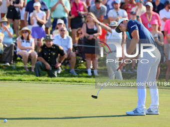 Viktor Hovland of Oslo, Norway putts on the 18th green during a playoff against Denny McCarthy of Jupiter, Florida during the final round of...