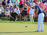 Viktor Hovland of Oslo, Norway putts on the 18th green during a playoff against Denny McCarthy of Jupiter, Florida during the final round of...