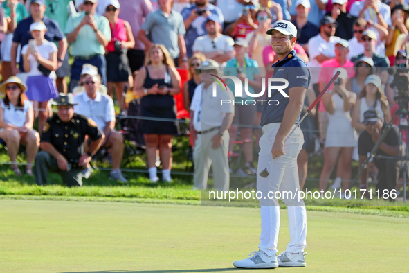 Viktor Hovland of Oslo, Norway reacts to his putt on the 18th green during a playoff against Denny McCarthy of Jupiter, Florida during the f...