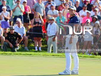 Viktor Hovland of Oslo, Norway reacts to his putt on the 18th green during a playoff against Denny McCarthy of Jupiter, Florida during the f...