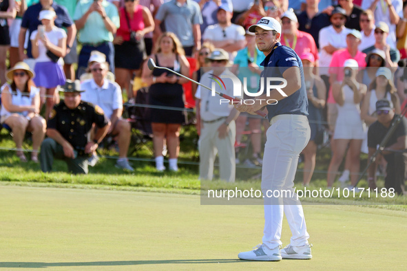 Viktor Hovland of Oslo, Norway follows his putt on the 18th green during a playoff against Denny McCarthy of Jupiter, Florida during the fin...