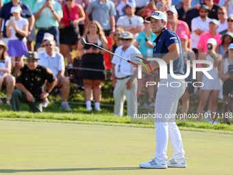 Viktor Hovland of Oslo, Norway follows his putt on the 18th green during a playoff against Denny McCarthy of Jupiter, Florida during the fin...