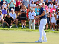 Viktor Hovland of Oslo, Norway follows his putt on the 18th green during a playoff against Denny McCarthy of Jupiter, Florida during the fin...