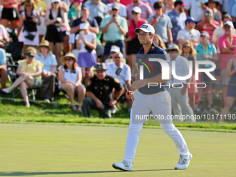 Viktor Hovland of Oslo, Norway walks on the 18th green during a playoff against Denny McCarthy of Jupiter, Florida during the final round of...