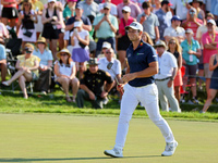 Viktor Hovland of Oslo, Norway walks on the 18th green during a playoff against Denny McCarthy of Jupiter, Florida during the final round of...