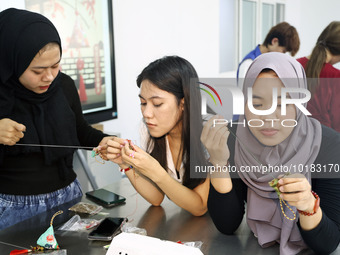 Foreign students make perfume sachets at the School of International Education at Nantong Vocational College of Science and Technology in Na...