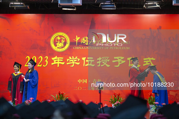 A general view of the 2023 graduation ceremony of China University of Petroleum in Qingdao, Shandong Province, China, June 20, 2023. Thousan...