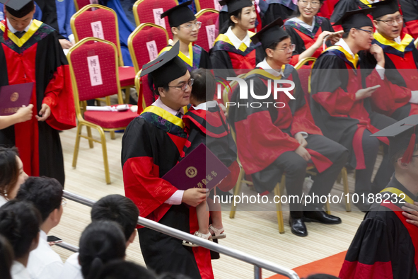 A general view of the 2023 graduation ceremony of China University of Petroleum in Qingdao, Shandong Province, China, June 20, 2023. Thousan...