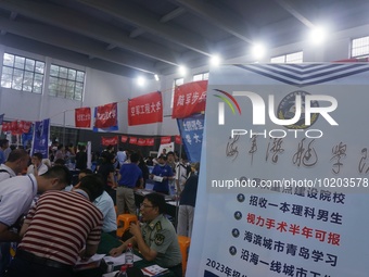  Students and their parents learn about enrollment information at the Zhejiang 2023 College Enrollment Public Consultation in Hangzhou, East...