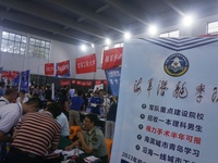  Students and their parents learn about enrollment information at the Zhejiang 2023 College Enrollment Public Consultation in Hangzhou, East...