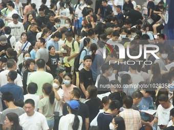  Students and their parents learn about enrollment information at the Zhejiang 2023 College Enrollment Public Consultation in Hangzhou, East...