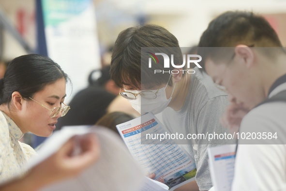  Students and their parents learn about enrollment information at the Zhejiang 2023 College Enrollment Public Consultation in Hangzhou, East...