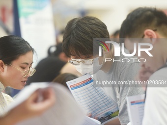  Students and their parents learn about enrollment information at the Zhejiang 2023 College Enrollment Public Consultation in Hangzhou, East...