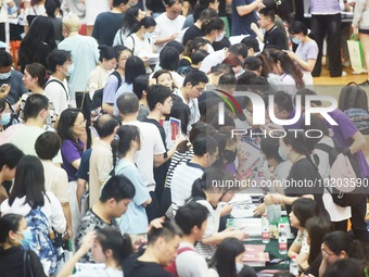  Students and their parents learn about enrollment information at the Zhejiang 2023 College Enrollment Public Consultation in Hangzhou, East...