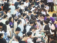  Students and their parents learn about enrollment information at the Zhejiang 2023 College Enrollment Public Consultation in Hangzhou, East...