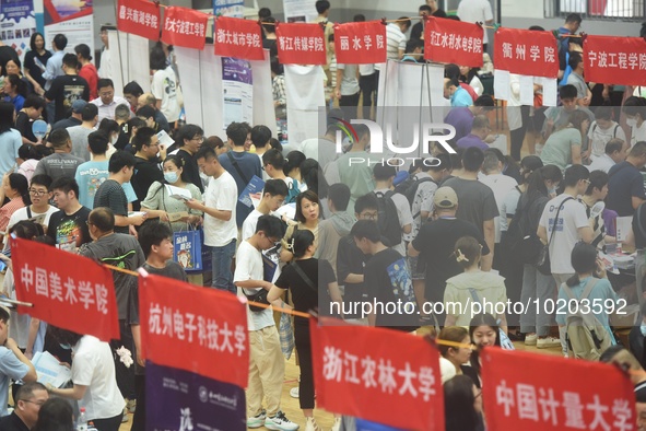  Students and their parents learn about enrollment information at the Zhejiang 2023 College Enrollment Public Consultation in Hangzhou, East...