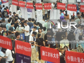  Students and their parents learn about enrollment information at the Zhejiang 2023 College Enrollment Public Consultation in Hangzhou, East...