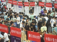  Students and their parents learn about enrollment information at the Zhejiang 2023 College Enrollment Public Consultation in Hangzhou, East...