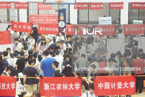  Students and their parents learn about enrollment information at the Zhejiang 2023 College Enrollment Public Consultation in Hangzhou, East...