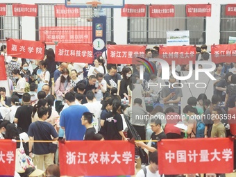  Students and their parents learn about enrollment information at the Zhejiang 2023 College Enrollment Public Consultation in Hangzhou, East...