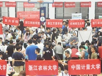  Students and their parents learn about enrollment information at the Zhejiang 2023 College Enrollment Public Consultation in Hangzhou, East...