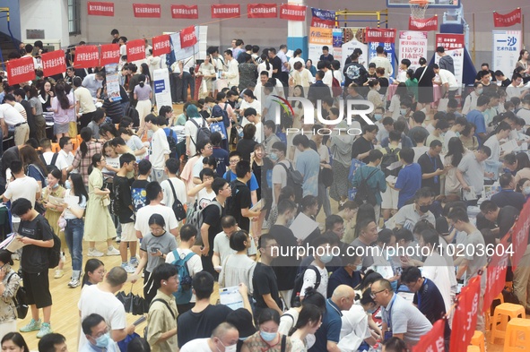  Students and their parents learn about enrollment information at the Zhejiang 2023 College Enrollment Public Consultation in Hangzhou, East...