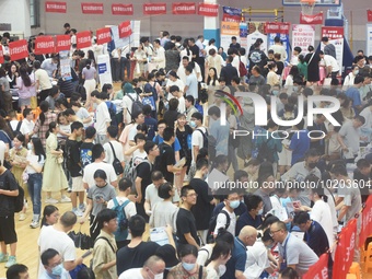  Students and their parents learn about enrollment information at the Zhejiang 2023 College Enrollment Public Consultation in Hangzhou, East...