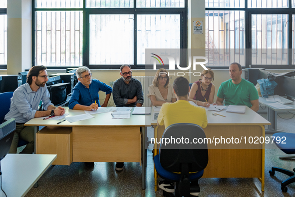 Oral exam board for a candidate at I.I.S.S. ''Mons. Antonio Bello'' vocational institute in Molfetta, the first day of high school graduatio...