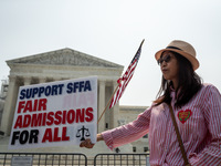 Min Chen of the DC chapter of the Asian America  Political Action Committee celebrates theUS Supreme Court ruling that universities may not...