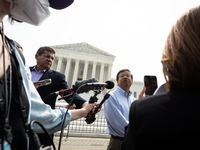 Yukong Mike Zhao of the Asian American Coalition for Education talks with reporters as he celebrate the US Supreme Court ruling that univers...