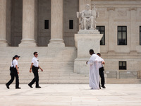 US Supreme Court move to arrest a man who entered a prohibited area of the plaza during demonstrations for and against the Court’s ruling th...