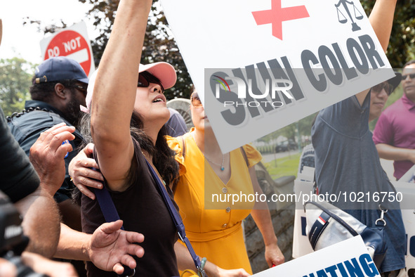 A person celebrating the US Supreme Court ruling that universities may not consider race in admissions, effectively ending affirmative actio...