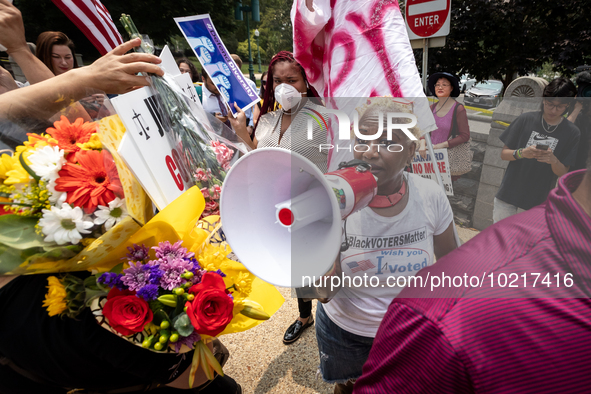 Activist Nadine Seiler voices her displeasure with the US Supreme Court ruling that universities may not consider race in admissions, amid a...