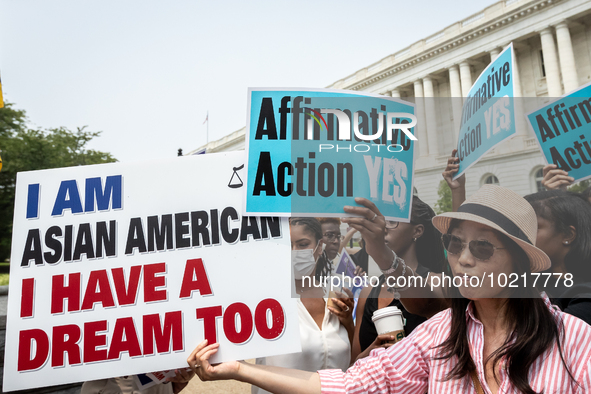 People protest (blue signs) and celebrate (white sign) the US Supreme Court ruling that universities cannot consider race in admissions.  Th...