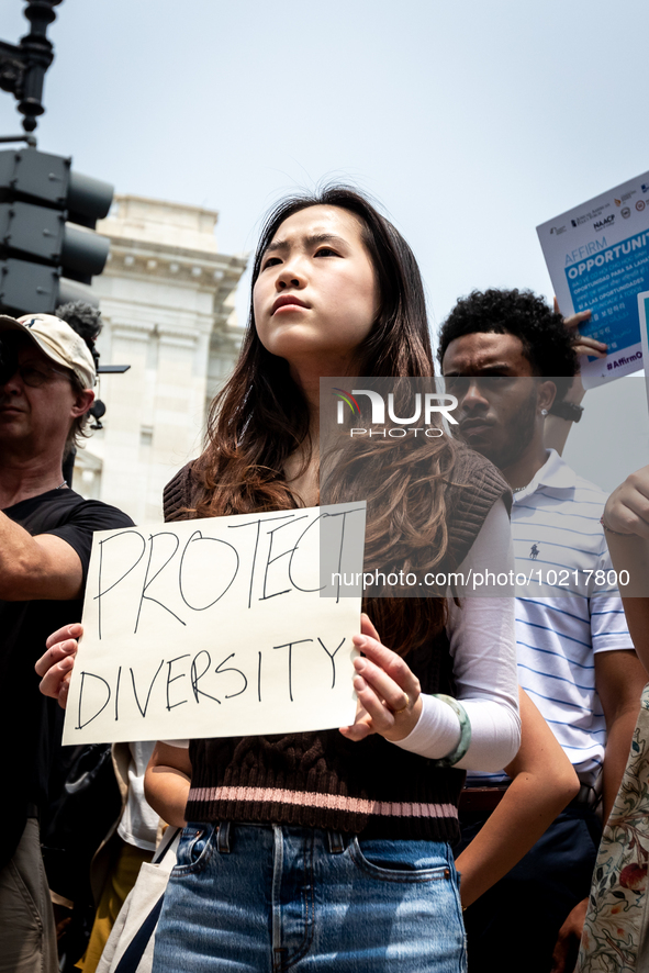 A woman protests the US Supreme Court ruling that universities cannot consider race in admissions.  The pair of cases brought by Students fo...