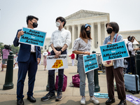 Asian-Americans protest the US Supreme Court ruling that universities cannot consider race in admissions.  The pair of cases brought by Stud...