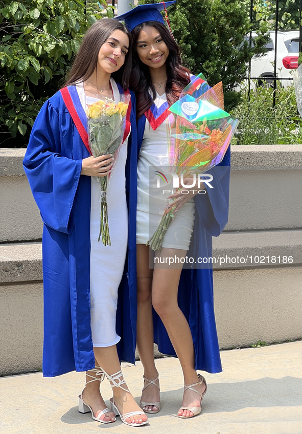 Youth dressed in caps and gowns celebrate their high school graduation in Toronto, Ontario, Canada, on June 29, 2023. 