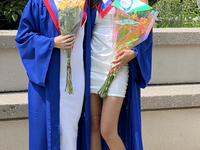 Youth dressed in caps and gowns celebrate their high school graduation in Toronto, Ontario, Canada, on June 29, 2023. (