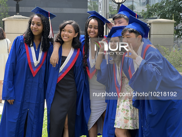 Youth dressed in caps and gowns celebrate their high school graduation in Toronto, Ontario, Canada, on June 29, 2023. 