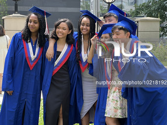 Youth dressed in caps and gowns celebrate their high school graduation in Toronto, Ontario, Canada, on June 29, 2023. (