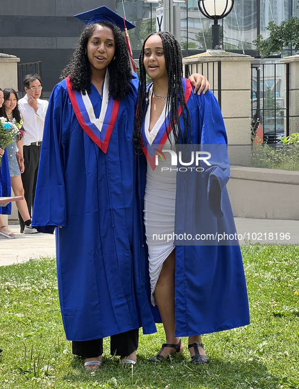 Youth dressed in caps and gowns celebrate their high school graduation in Toronto, Ontario, Canada, on June 29, 2023. 