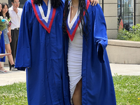 Youth dressed in caps and gowns celebrate their high school graduation in Toronto, Ontario, Canada, on June 29, 2023. (