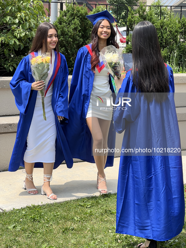 Youth dressed in caps and gowns celebrate their high school graduation in Toronto, Ontario, Canada, on June 29, 2023. 