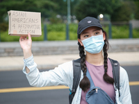 A demonstrator holds a sign outside of the Supreme Court in Washington, D.C. on June 30, 2023 following the Supreme Court's ruling striking...