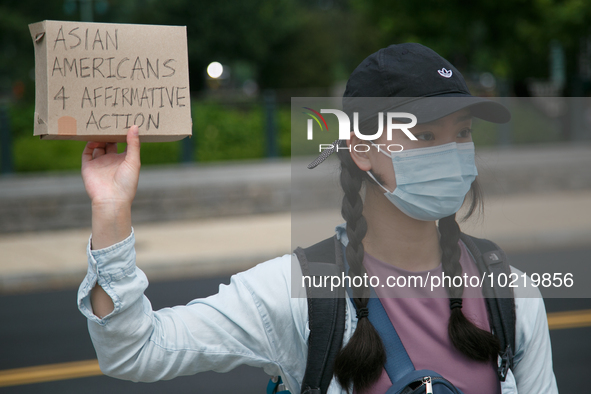 A demonstrator holds a sign outside of the Supreme Court in Washington, D.C. on June 30, 2023 following the Supreme Court's ruling striking...