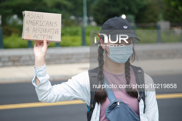 A demonstrator holds a sign outside of the Supreme Court in Washington, D.C. on June 30, 2023 following the Supreme Court's ruling striking...